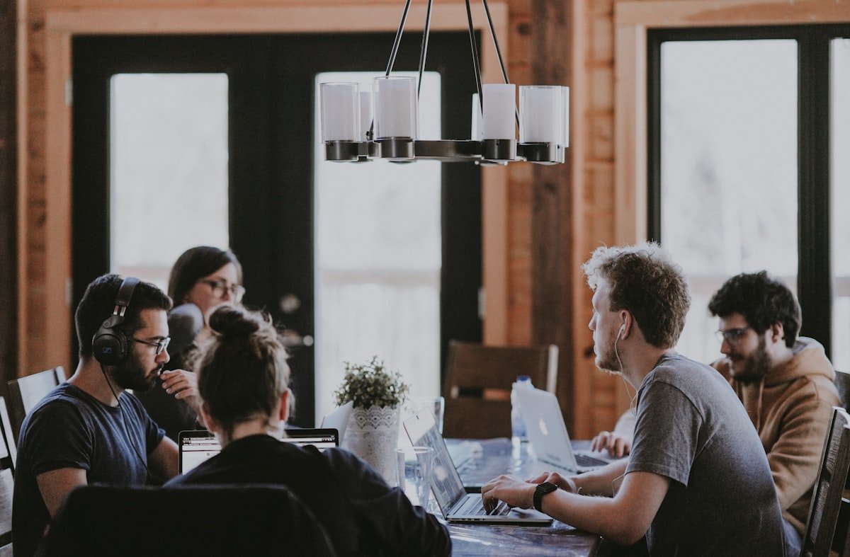 Founder-led OnePage advisory team collaborating in a modern office